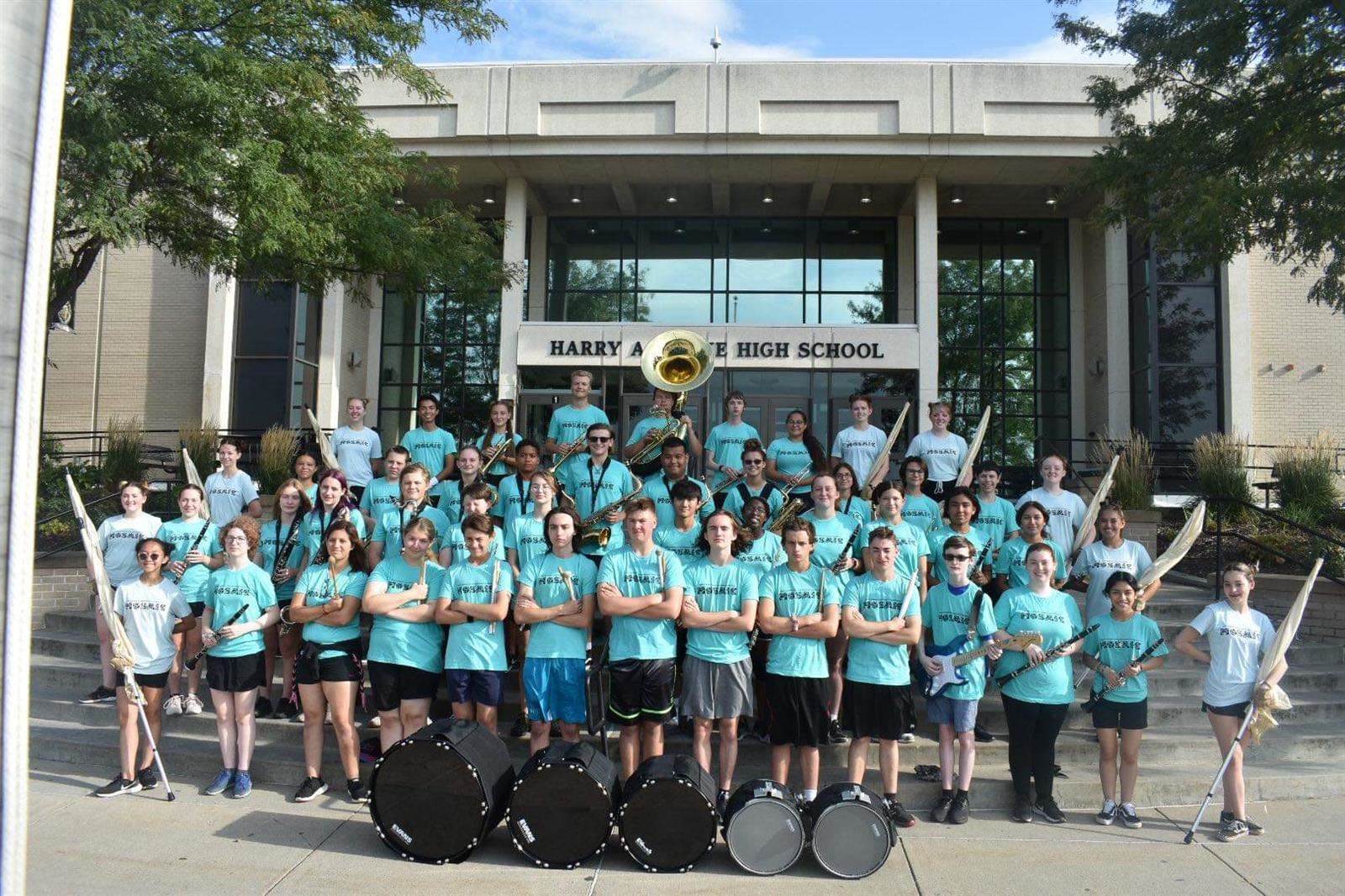 Picture of 2022 Burke Marching Band standing in front of the school.