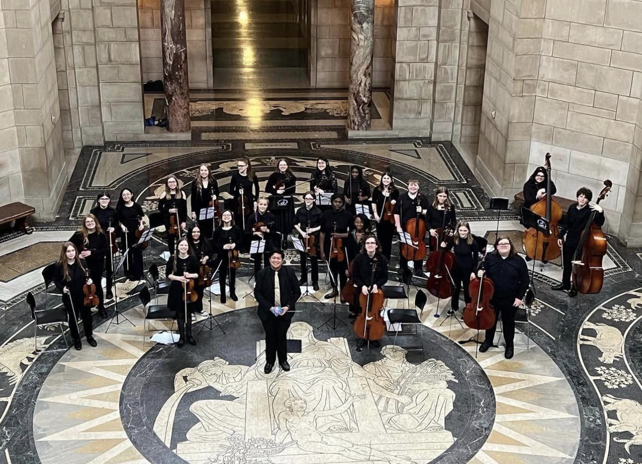 Picture of 2022 Chamber Orchestra standing in the Nebraska State Capitol Rotunda