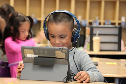 A student works at an iPad