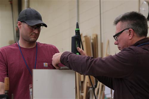 Staffers work on repairs