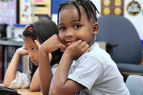 A child looks at the camera