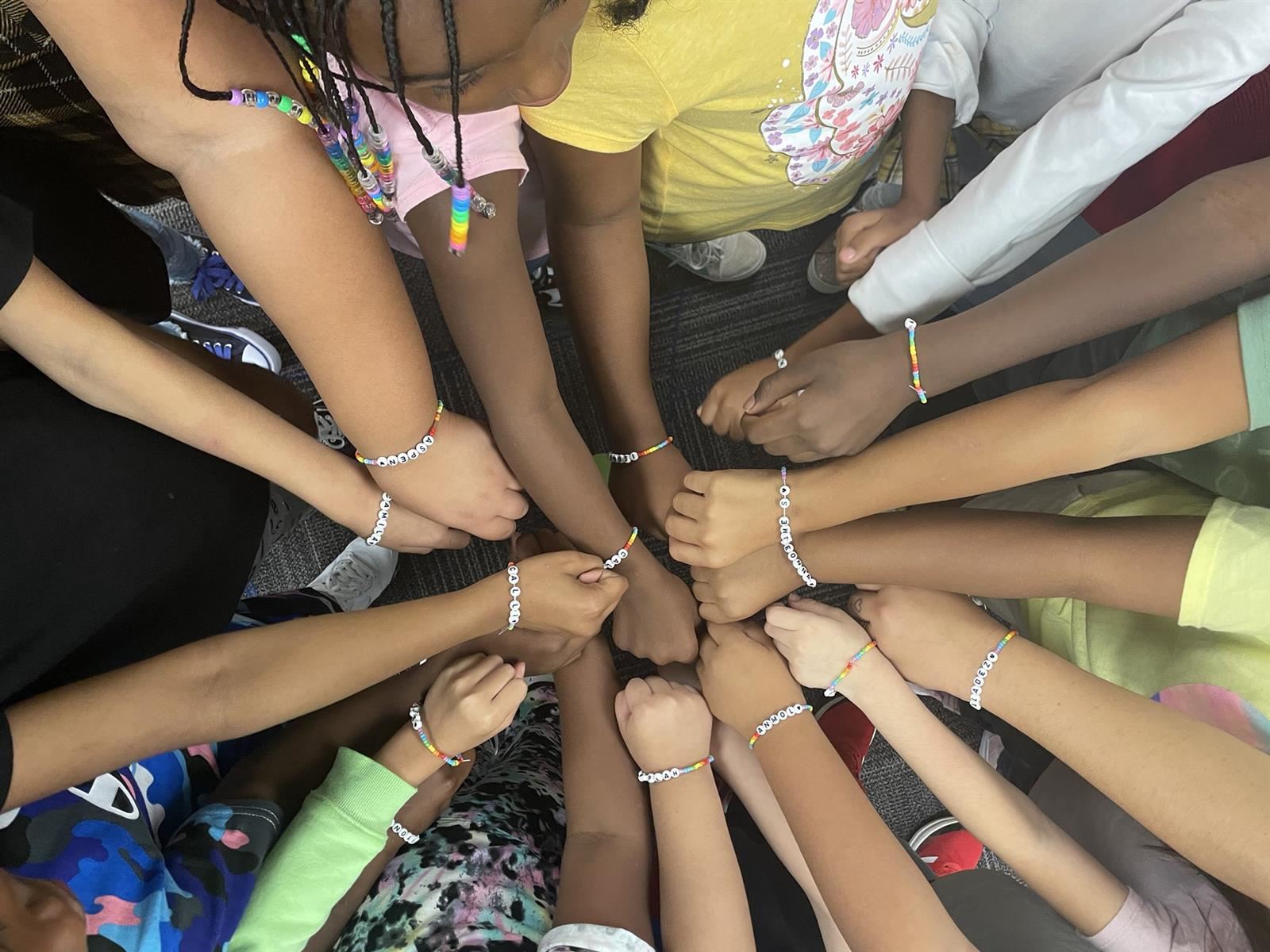 Kids with arms together
