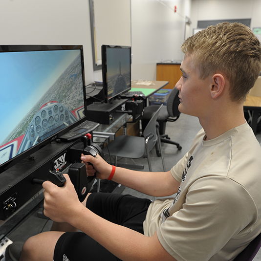  A student uses a flight simulation program on a computer