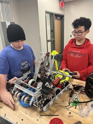 Students complete a robot together