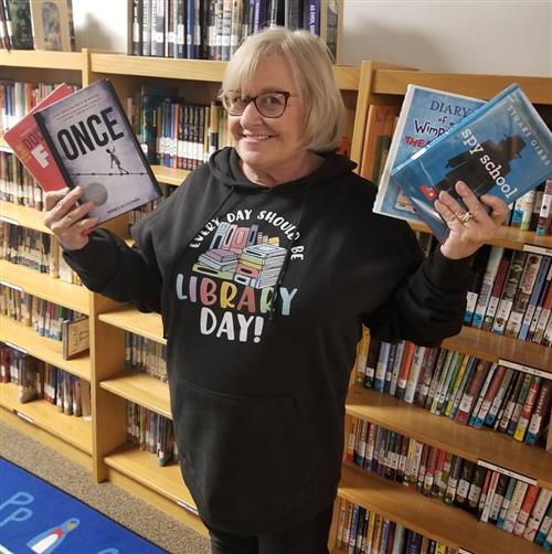 teacher holding books