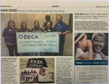 Morgan A. and Morgan S. presenting the Alzheimer's Association of Omaha a $3000.00 check.